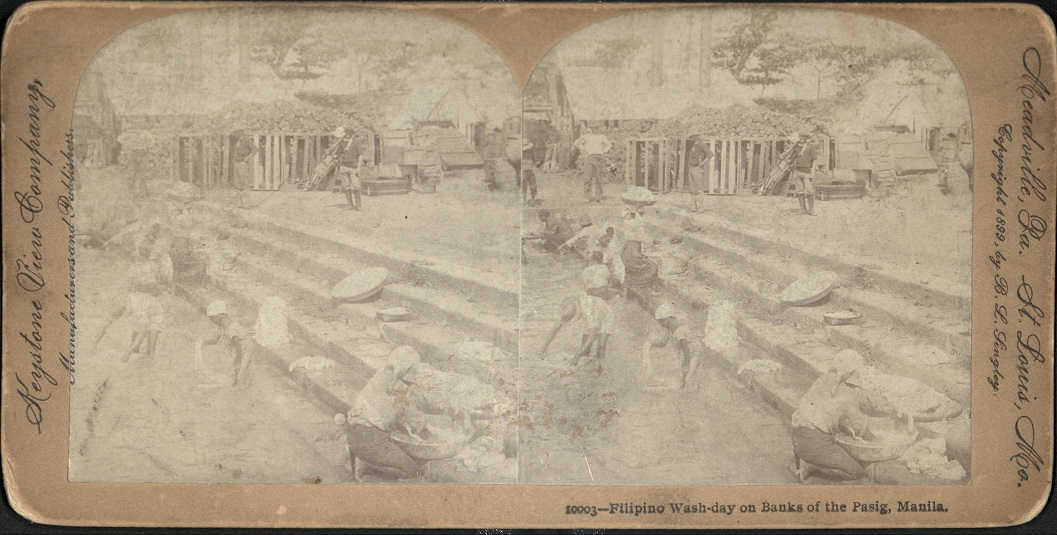 Filipino Wash-day on Banks of the Pasig, Manila,.